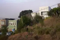 Billboard House, a small residential project in Bernal Heights, San Francisco, set within a steep urban landscape.