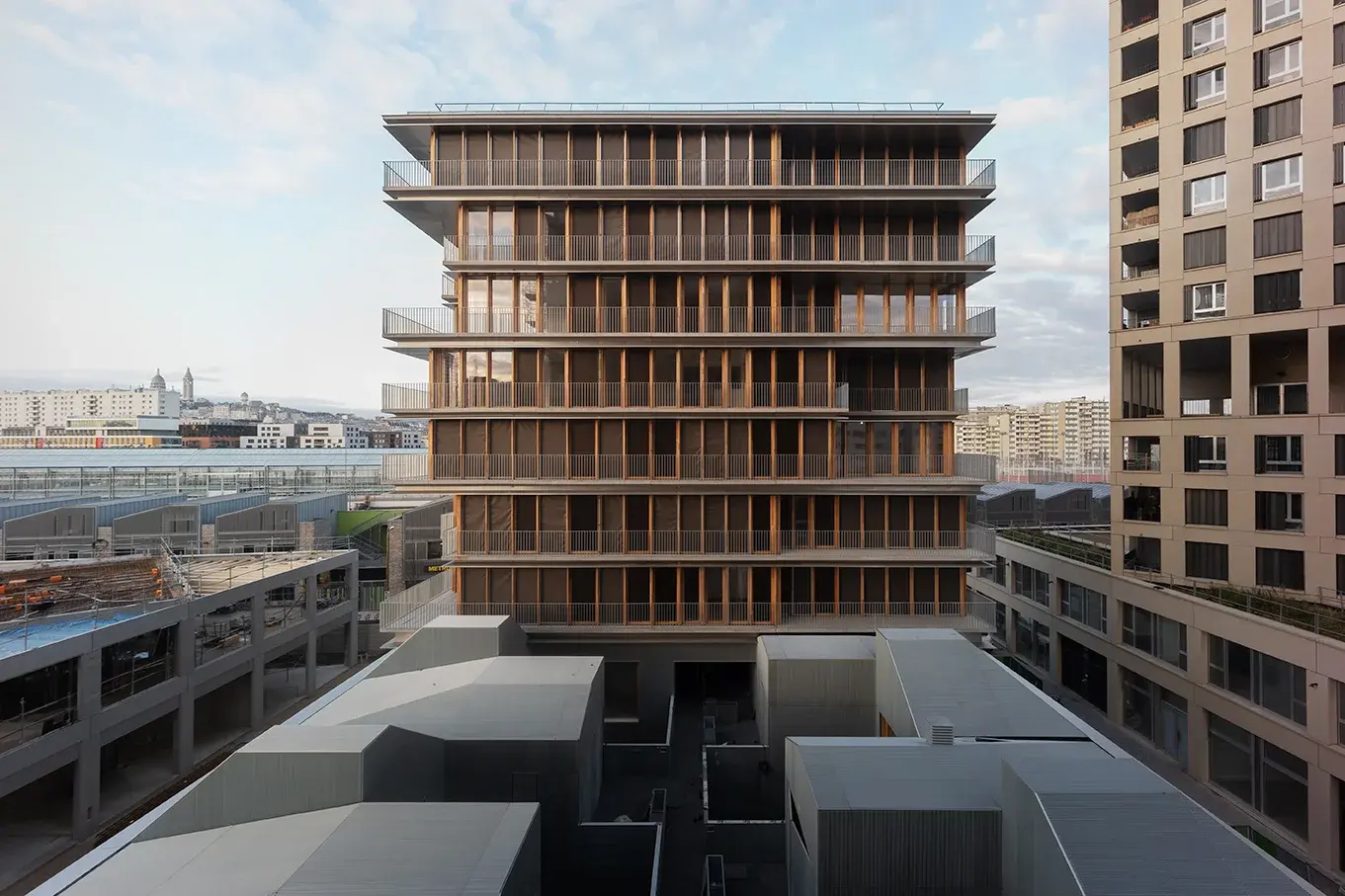 Chapelle International residential tower with sculptural white concrete exoskeleton, Paris, France