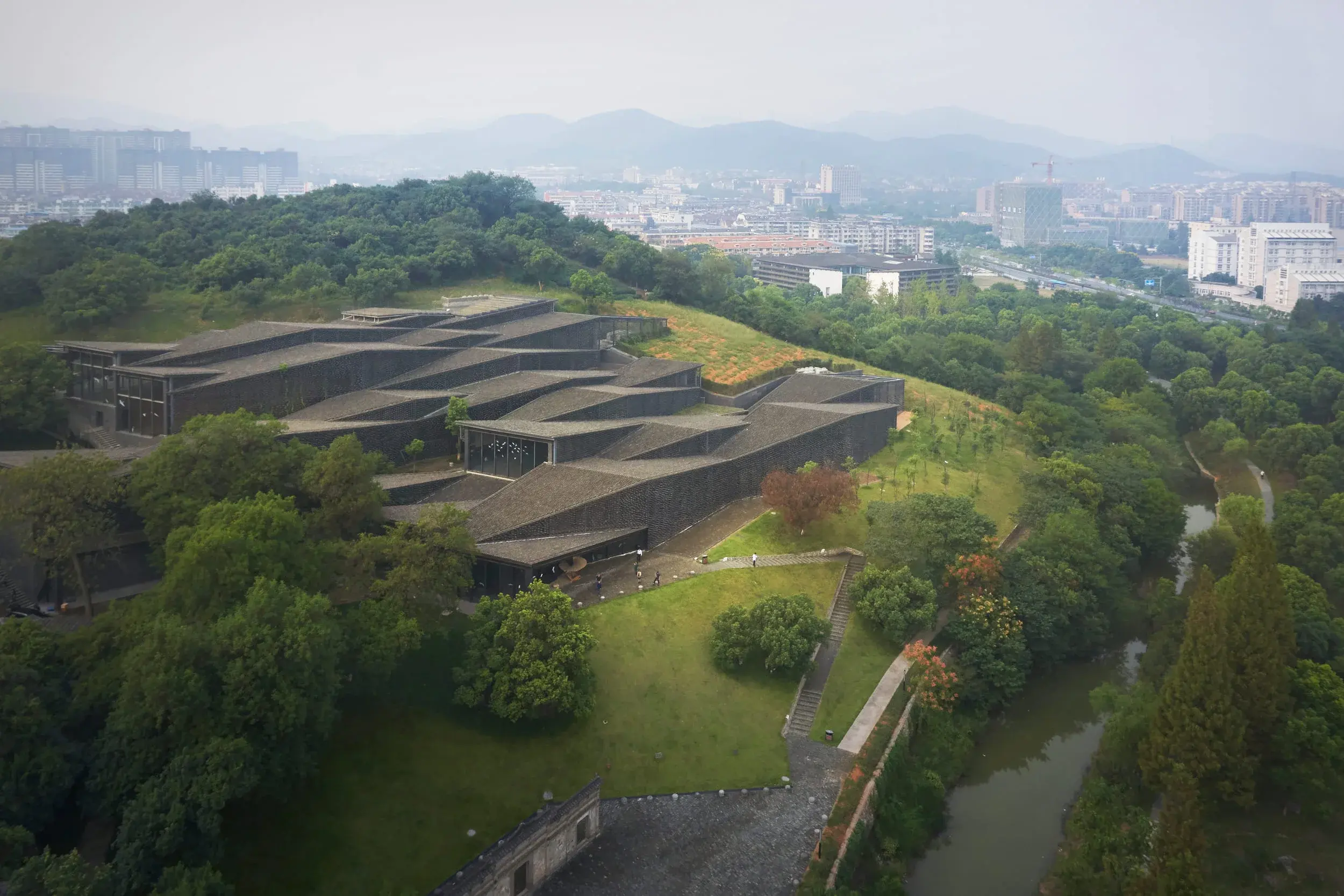 China Academy of Arts’ Folk Art Museum in Hangzhou by Kengo Kuma, set among tea gardens and reused roof tiles, Photography Julien Lanoo