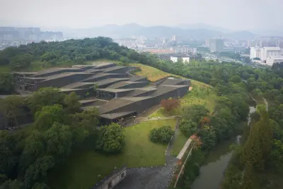 China Academy of Arts’ Folk Art Museum in Hangzhou by Kengo Kuma, set among tea gardens and reused roof tiles, Photography Julien Lanoo