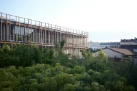 CNAM Landy 2 Extension in Paris with a view toward the shared garden and adjacent building volumes