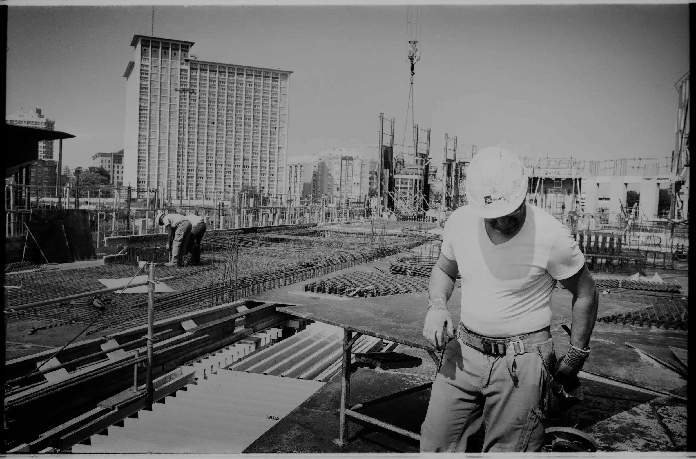 Construction of Ilot 10.8 in Lille, France, with the building rising within the Euralille urban fabric, Photography Julien Lanoo