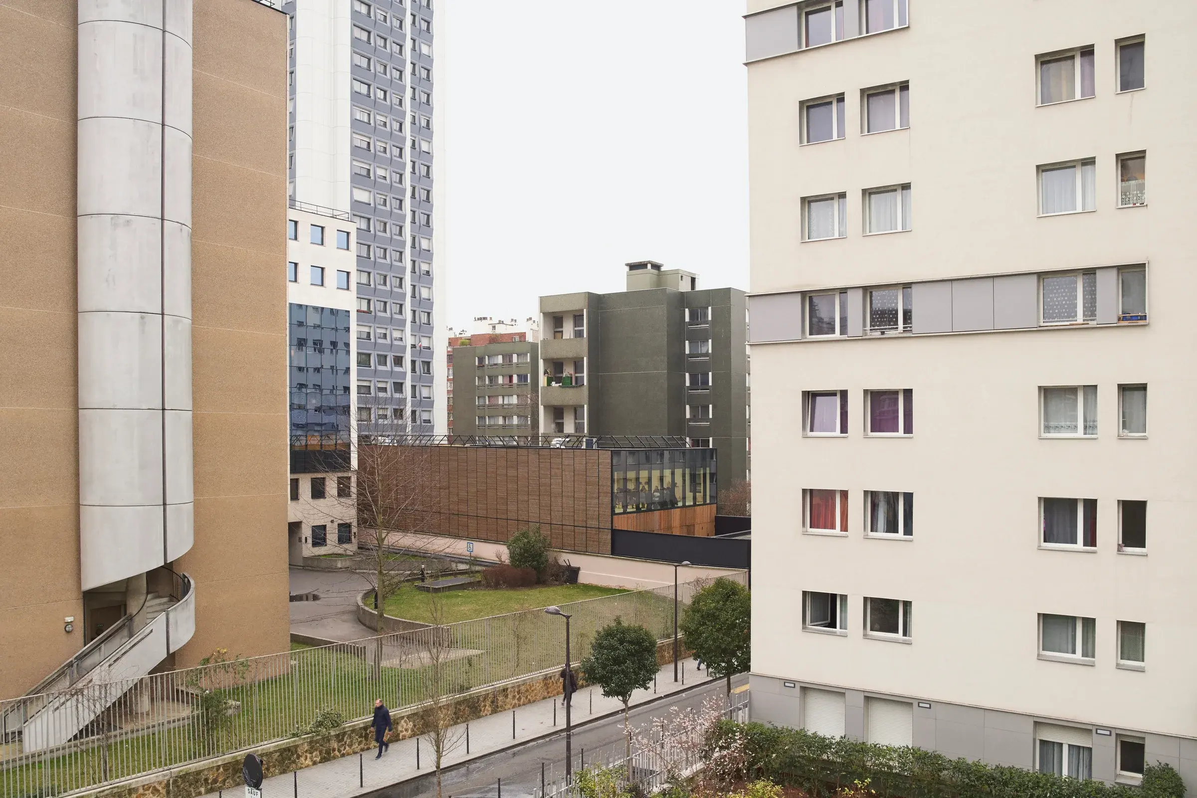 Crèche Saint-Blaise in Paris, France, by LAN, showing a layered nursery space with balcony access and daylight, Photography Julien Lanoo