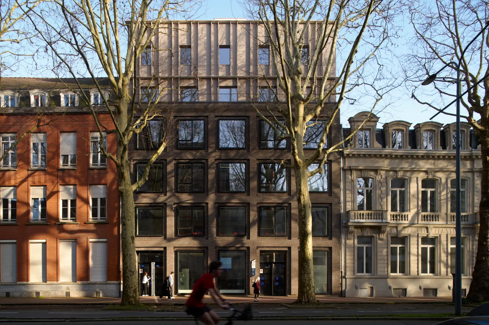 ESPOL campus building in Lille, France, by WONK Architectes, with landscaped foreground and Photography Julien Lanoo.