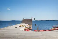 Faaborg Harbour Bath by Julien De Smedt Architects in Faaborg, Denmark, with wooden piers and protected swimming areas, Photography Julien Lanoo