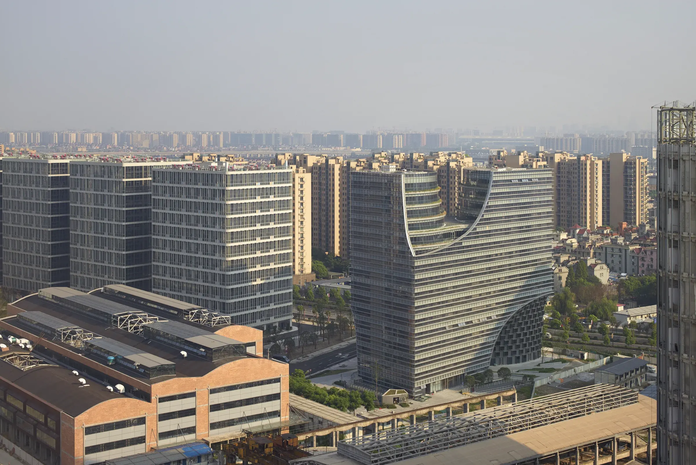 Hangzhou Gateway by Julien De Smedt Architects in Hangzhou, China, with its H-shaped tower and ground-level arch, Photography Julien Lanoo