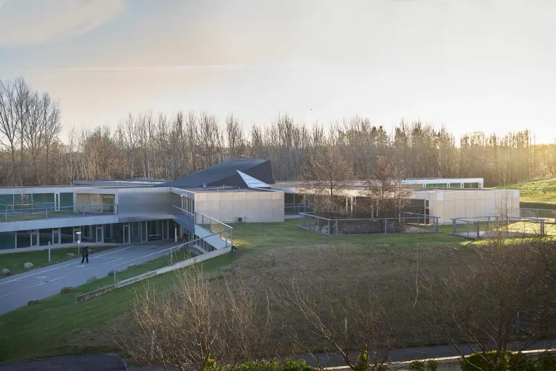Helsingør Psychiatric Hospital in Helsingør, Denmark, showing a quiet courtyard edge and connected hospital wings. Photography Julien Lanoo