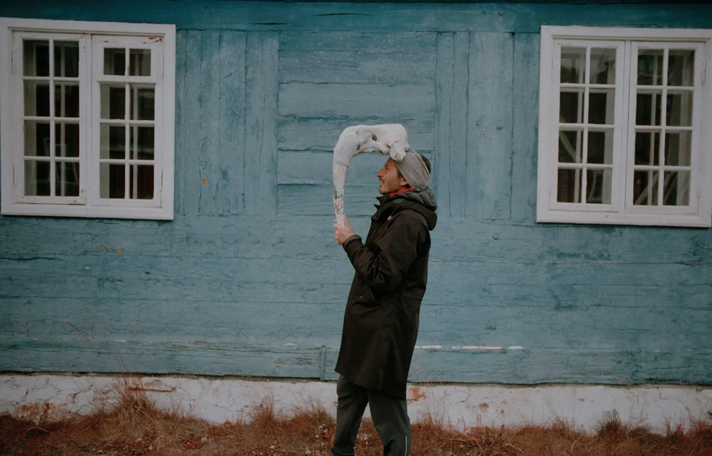 Konstantin Ikonomidis in Sarfannguit, Greenland, with a remote landscape backdrop, Photography Julien Lanoo