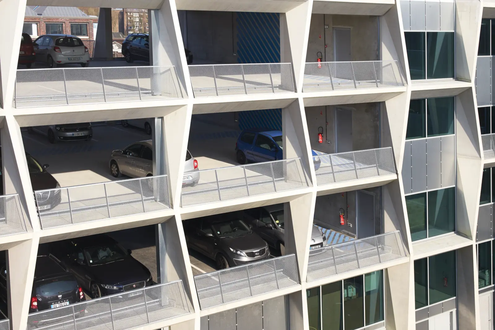 La Tossée project in Tourcoing showing the mixed-use structure and its textile-inspired facade, Photography Julien Lanoo
