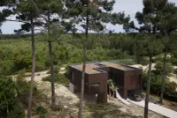 Maison des Landes timber house in Lit-et-Mixe, France, raised among pine trees