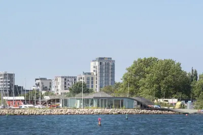Maritime Youth House in Copenhagen with a raised timber deck and waterfront terrace, Julien De Smedt Architects and BIG