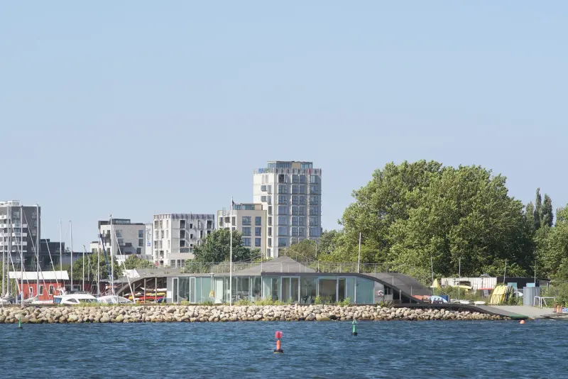 Maritime Youth House in Copenhagen with a raised timber deck and waterfront terrace, Julien De Smedt Architects and BIG