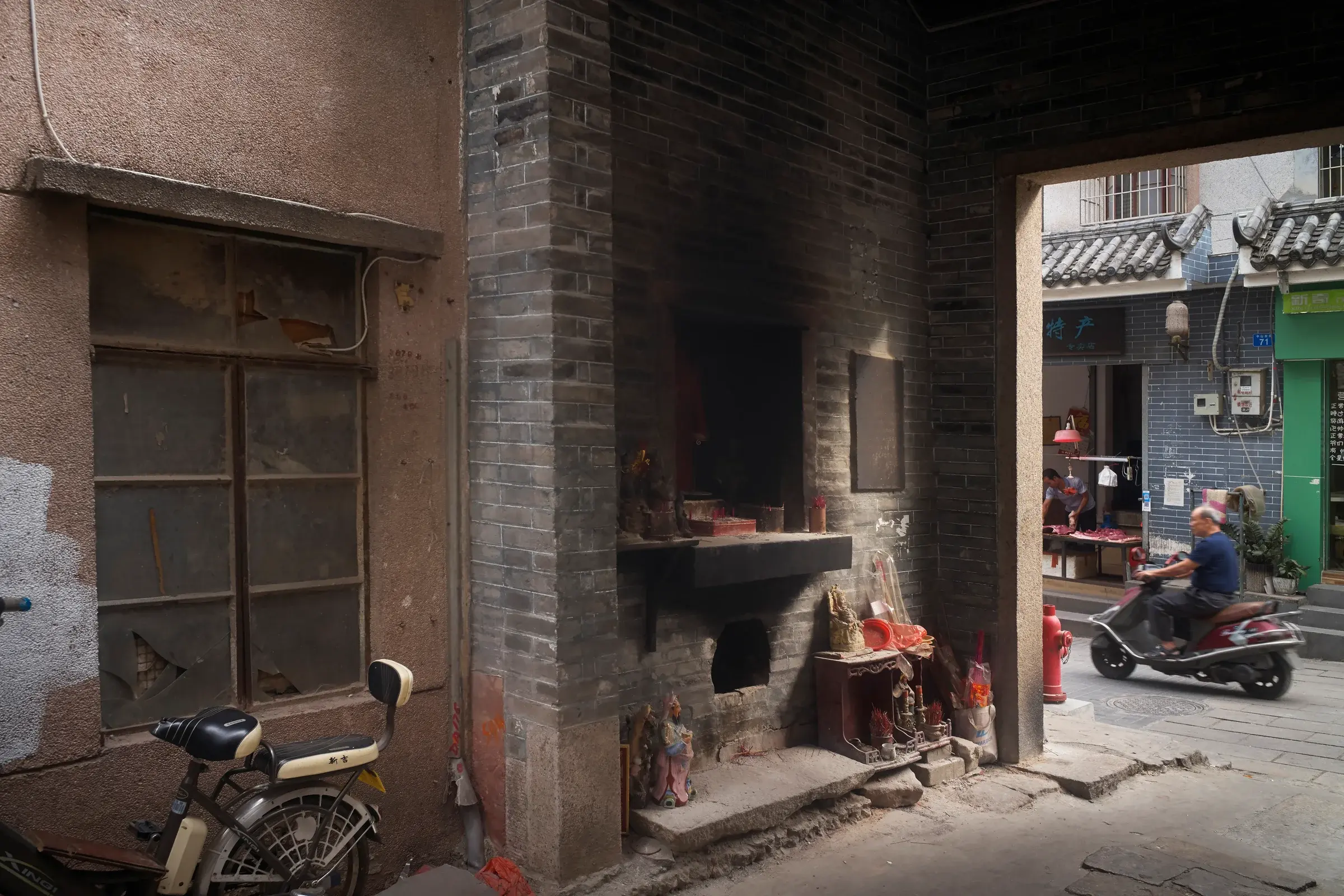 Nantou Old Town street scene in Shenzhen with layered buildings and daily life, Photography Julien Lanoo