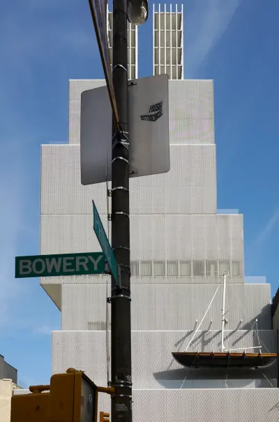 Vertical view of the New Museum of Contemporary Art in New York, showing its stacked form against the city.