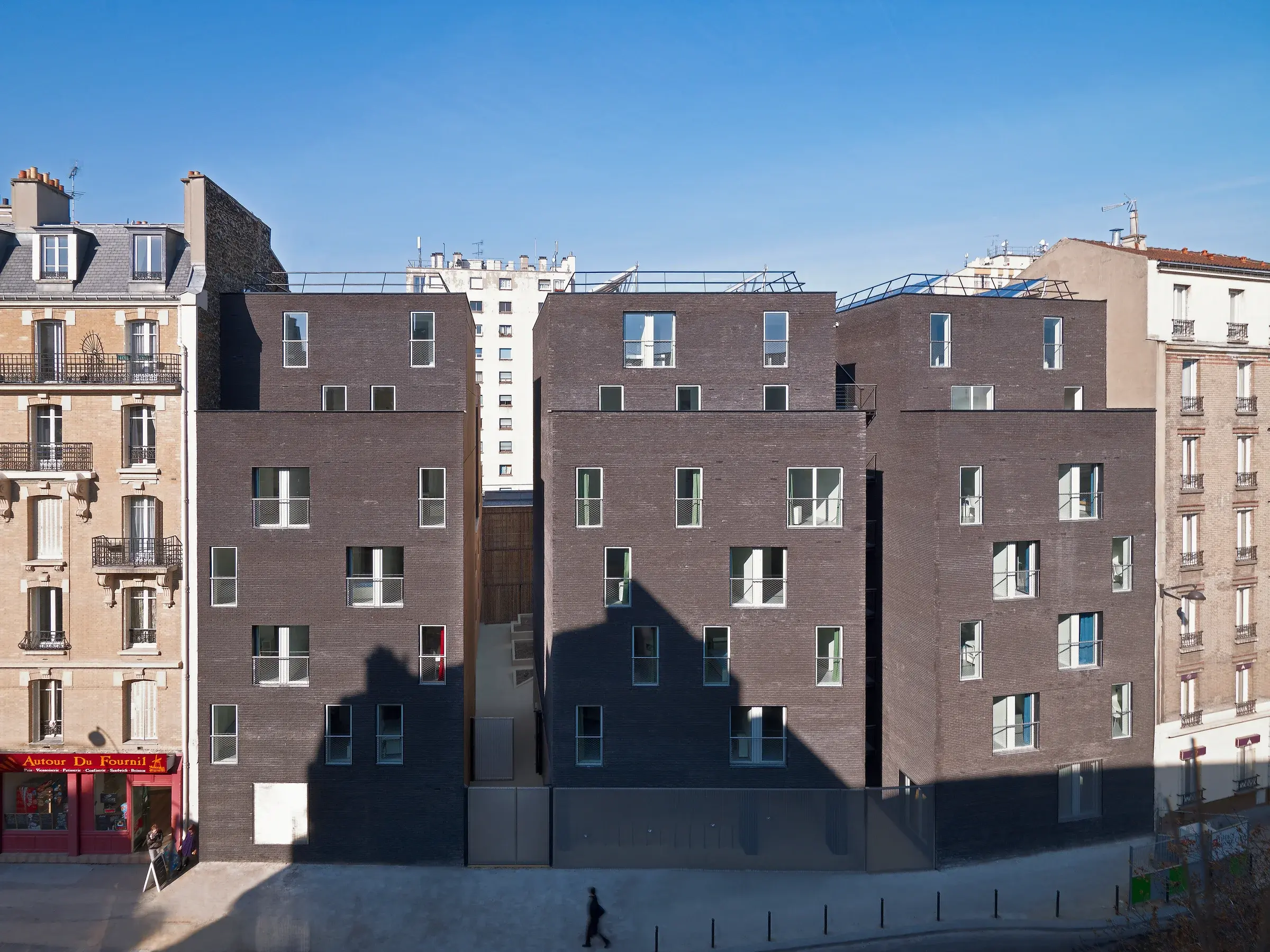 Exterior view of Pajol 2 Student Residence in Paris, France, by LAN, with brick façades and balconies
