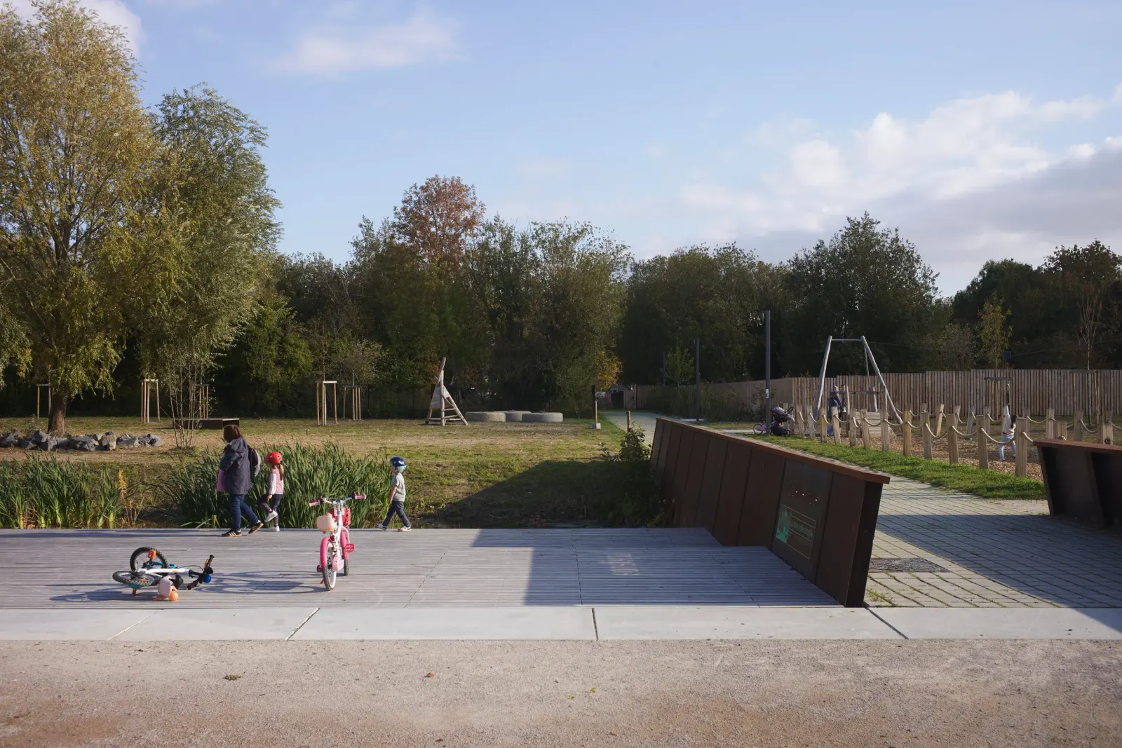 Parc Rosa Bonheur landscape path with dense planting and rain garden, Lille, France