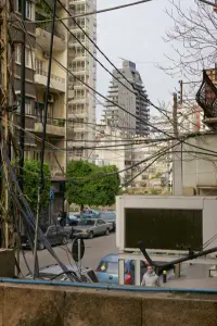 Plot #1072 by Bernard Khoury in Beirut, Lebanon, with a slim vertical form and reflective surfaces, Photography Julien Lanoo