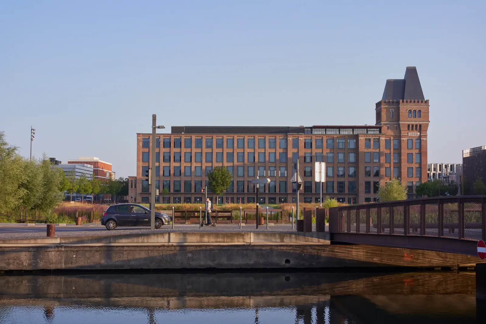 Rives de la Haute-Deûle in Lille with canal-side mixed-use buildings and landscape continuity, Photography Julien Lanoo