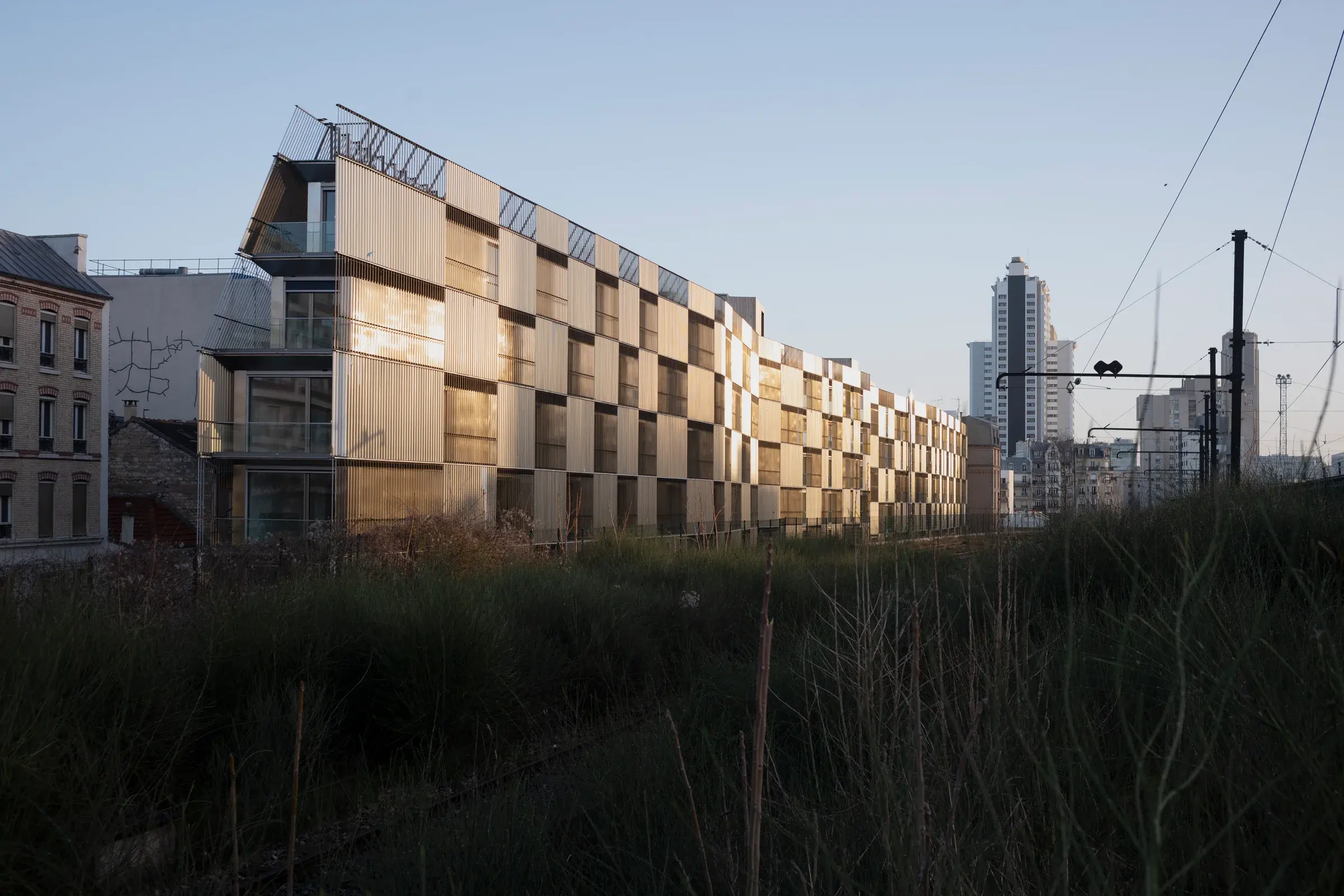 Rue Castagnary Residence by TANK Architectes in Paris, France, with a light-filtering façade and Photography Julien Lanoo