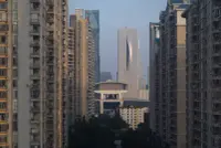 Shenzhen Energy Mansion viewed against the sky in Shenzhen, China, with layered facade depth, Photography Julien Lanoo