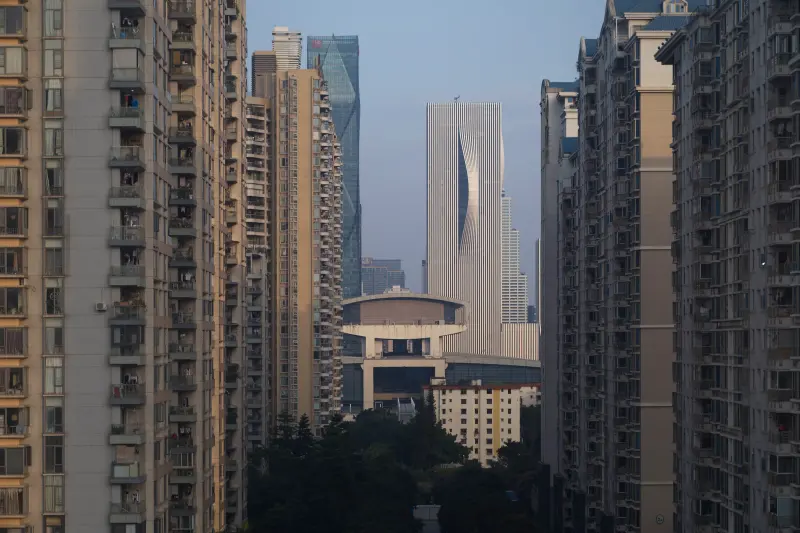Shenzhen Energy Mansion viewed against the sky in Shenzhen, China, with layered facade depth, Photography Julien Lanoo