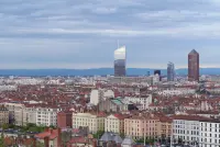 Tour Incity seen against the Lyon skyline, emphasizing its slender tower form