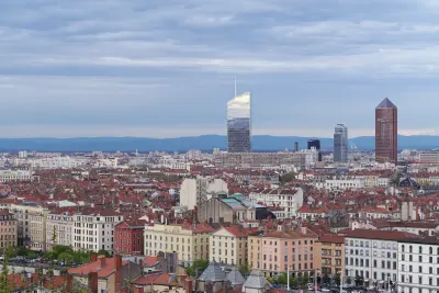 Tour Incity seen against the Lyon skyline, emphasizing its slender tower form