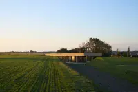 Visitor centre at Batterie de Longues-sur-Mer set low in the ground, Longues-sur-Mer, France, Photography Julien Lanoo