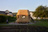 Tane Garden House by Tsuyoshi Tane in Weil am Rhein, Germany, with glazed openings and a wooden frame, Photography Julien Lanoo